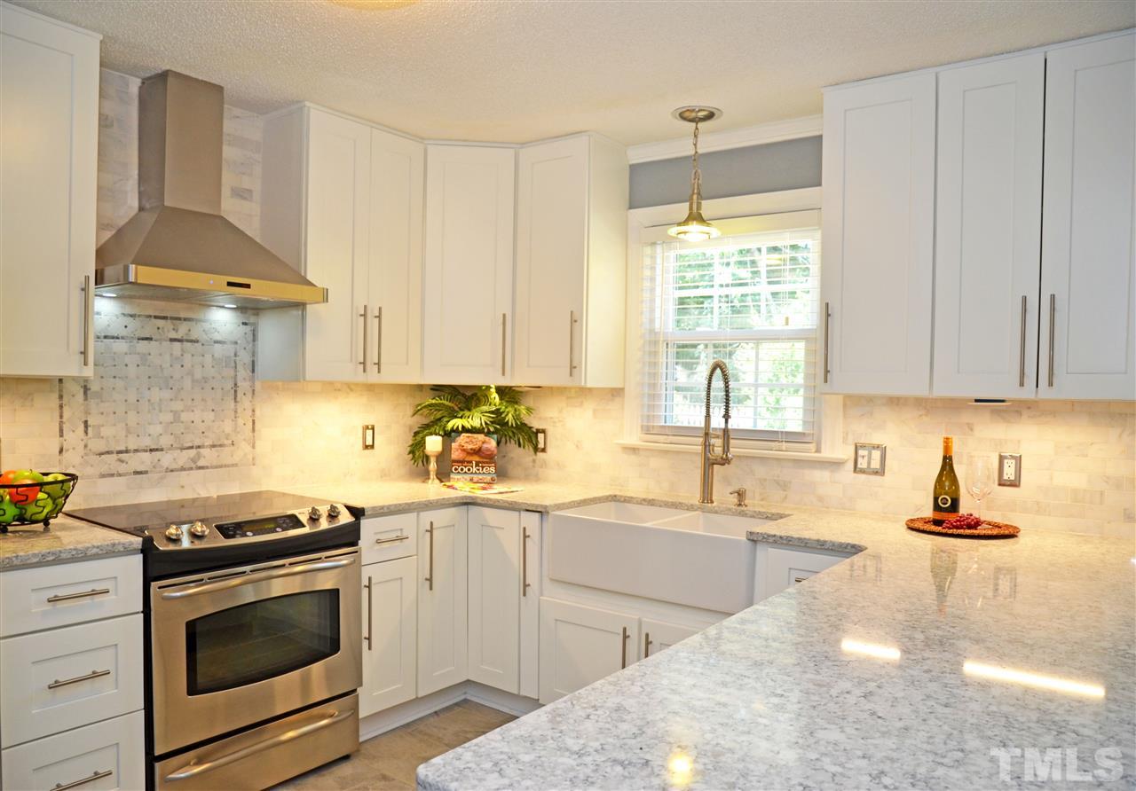 2809 Bolo Trail Raleigh, NC 27615 - Photo 2 of 27 Kitchen has been completely gutted and updated w/ new cabinets w/ soft close drawers, tile backsplash, quartz counters, stainless appliances, lighting & flooring!