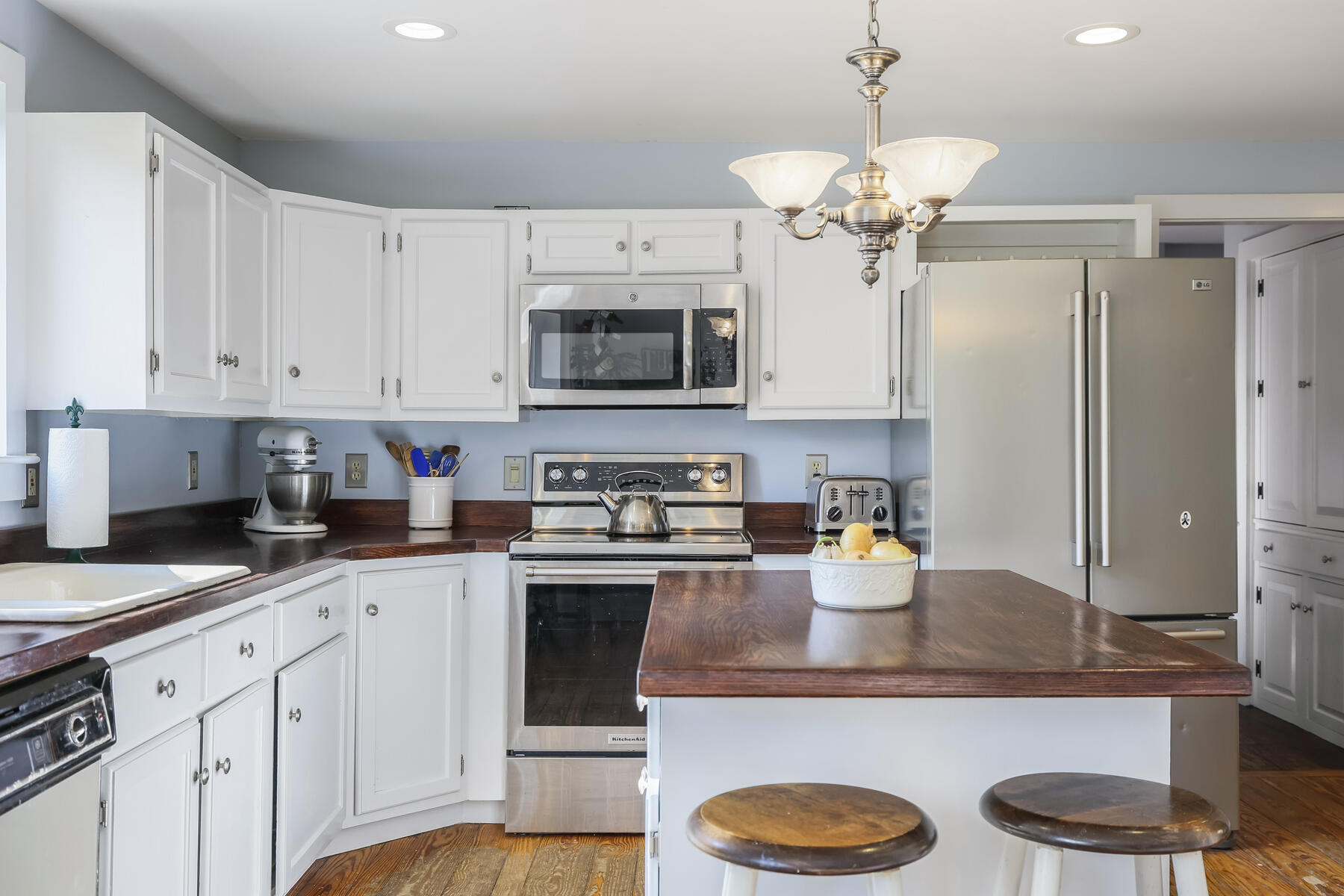 2 Greengate Road Falmouth, MA 02540 - Photo 6 of 51 a kitchen with kitchen island granite countertop stainless steel appliances a sink a stove and cabinets