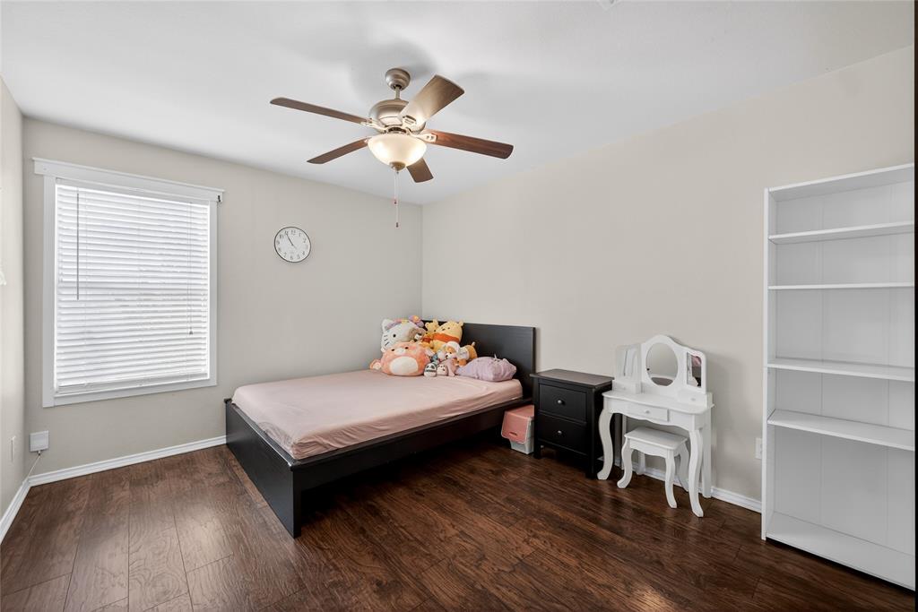 9633 Anns Way Plano, TX 75025 - Photo 27 of 37 a bedroom with a bed and a window