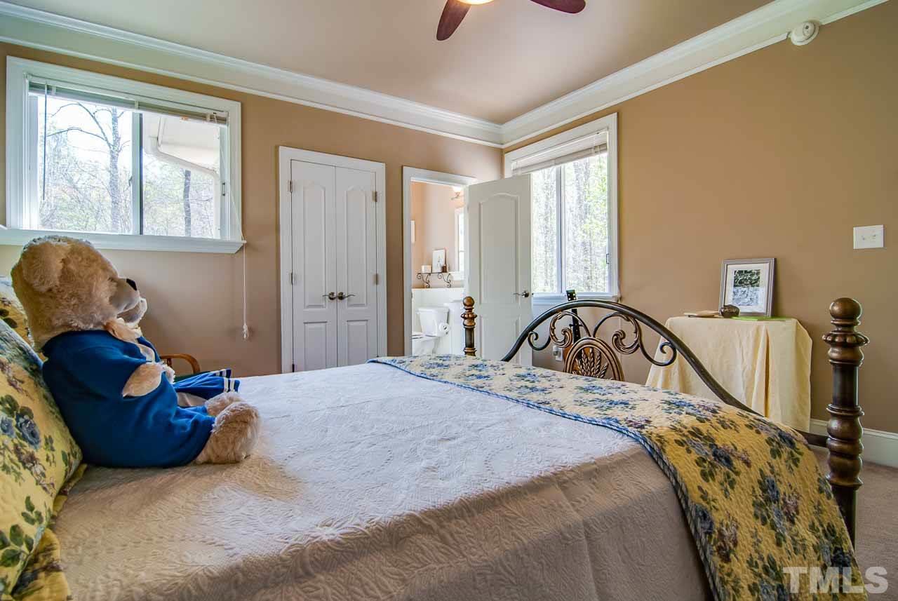 402 Bowen Road Rougemont, NC 27572 - Photo 14 of 25 a bedroom with a bed and wooden floor