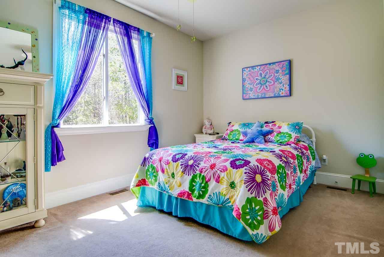 402 Bowen Road Rougemont, NC 27572 - Photo 16 of 25 a bedroom with a bed and a painting on the wall