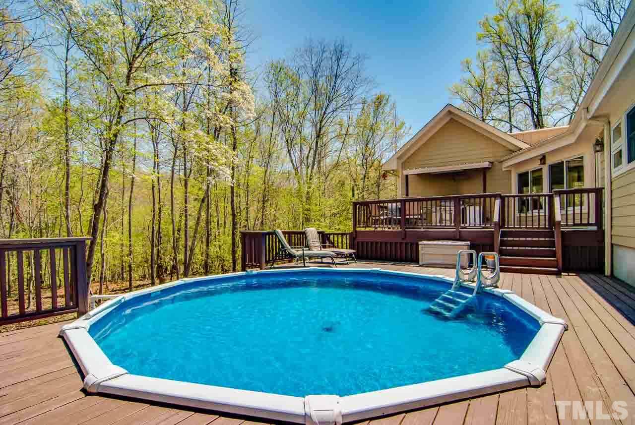 402 Bowen Road Rougemont, NC 27572 - Photo 19 of 25 a view of a swimming pool with a patio and a yard