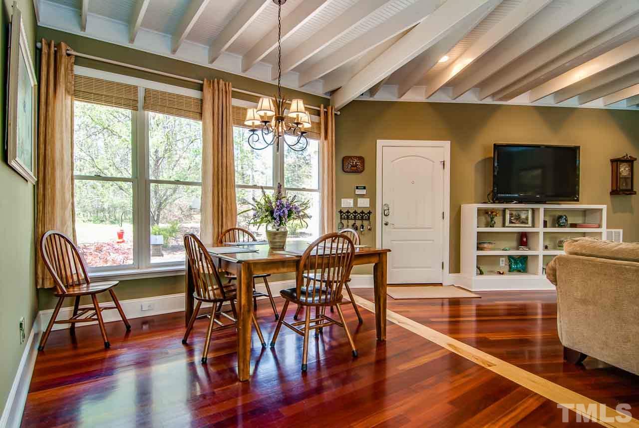 402 Bowen Road Rougemont, NC 27572 - Photo 4 of 25 a view of a dining room with furniture window and wooden floor