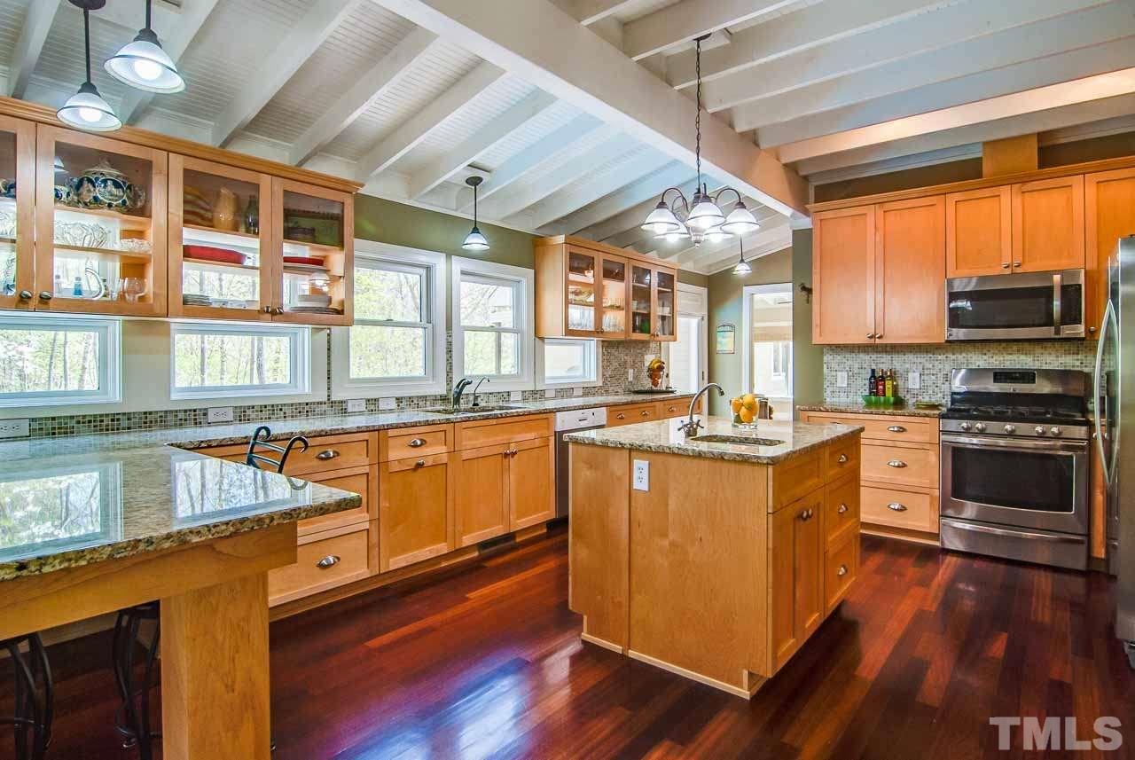 402 Bowen Road Rougemont, NC 27572 - Photo 8 of 25 a kitchen with stainless steel appliances granite countertop a stove and a sink
