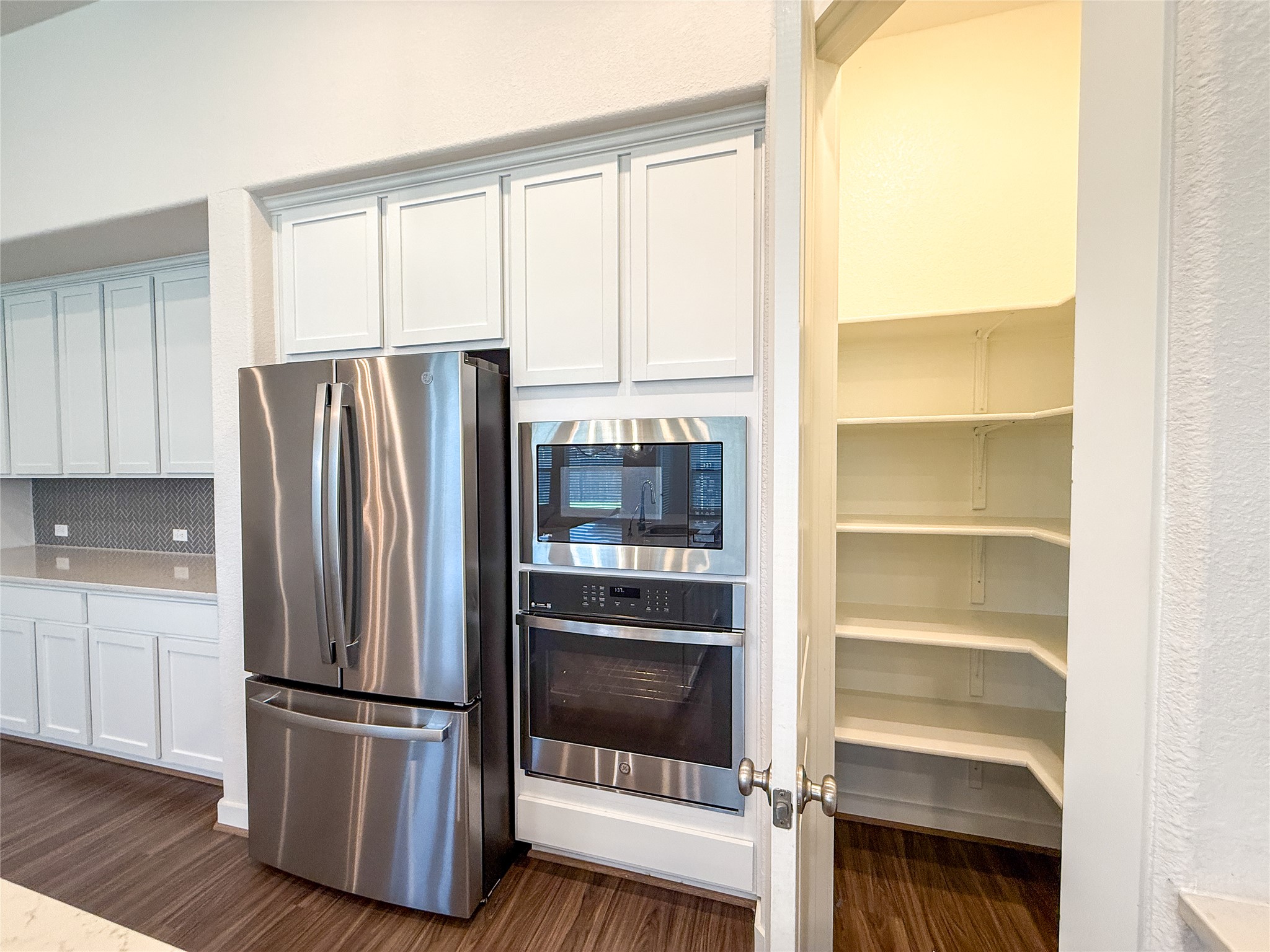 249 Heartleaf Road San Marcos, TX 78666 - Photo 10 of 38 A well-appointed kitchen features stainless steel appliances and a convenient walk-in pantry.