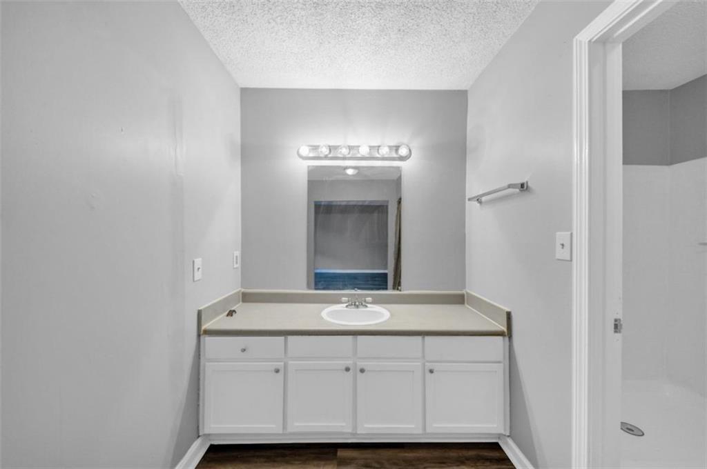 3575 Oakvale Road, Unit 504 Decatur, GA 30034 - Photo 11 of 13 a bathroom with a sink and a mirror