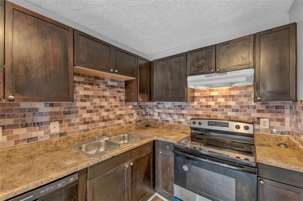 3575 Oakvale Road, Unit 504 Decatur, GA 30034 - Photo 6 of 13 a kitchen with sink cabinets and window