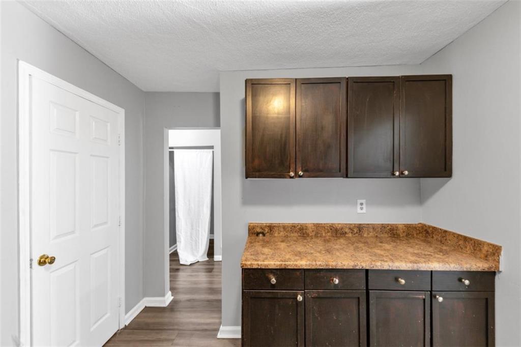 3575 Oakvale Road, Unit 504 Decatur, GA 30034 - Photo 7 of 13 a kitchen with granite countertop a sink and cabinets
