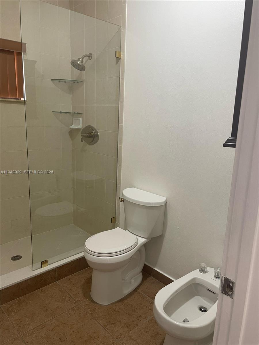 11115 West Okeechobee Road, Unit 154 Hialeah Gardens, FL 33018 - Photo 17 of 30 a white toilet sitting next to a bathroom sink