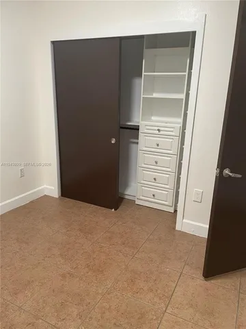 a view of an empty walk in closet