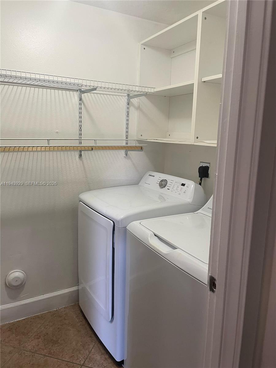 11115 West Okeechobee Road, Unit 154 Hialeah Gardens, FL 33018 - Photo 27 of 30 a utility room with dryer and washer