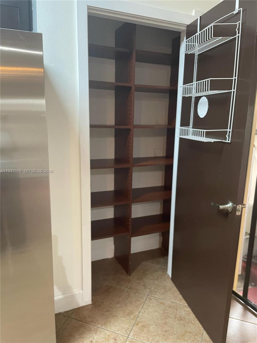 11115 West Okeechobee Road, Unit 154 Hialeah Gardens, FL 33018 - Photo 28 of 30 a view of an empty walk in closet