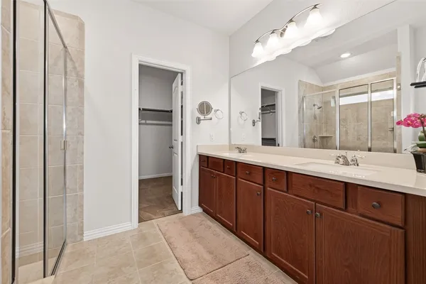 a bathroom with a shower and a sink