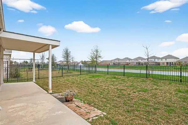 a view of a house with a garden and yard