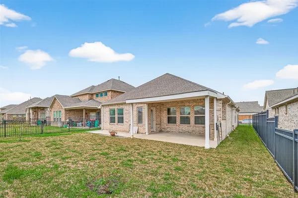 a view of a lake with houses in the background