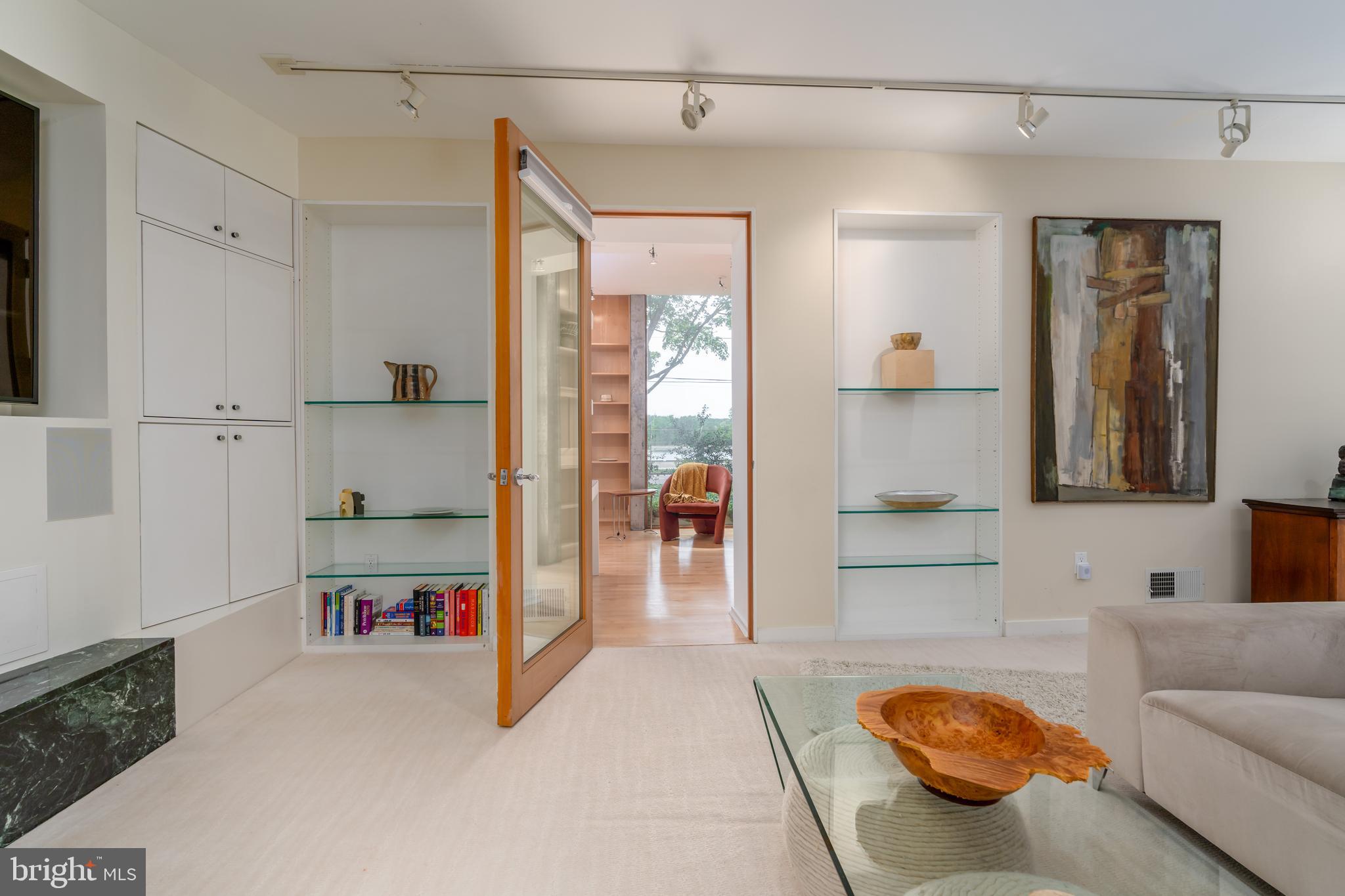 4770 Reservoir Road Northwest Washington, DC 20007 - Photo 39 of 50 Spacious LL Family room with glass display shelves