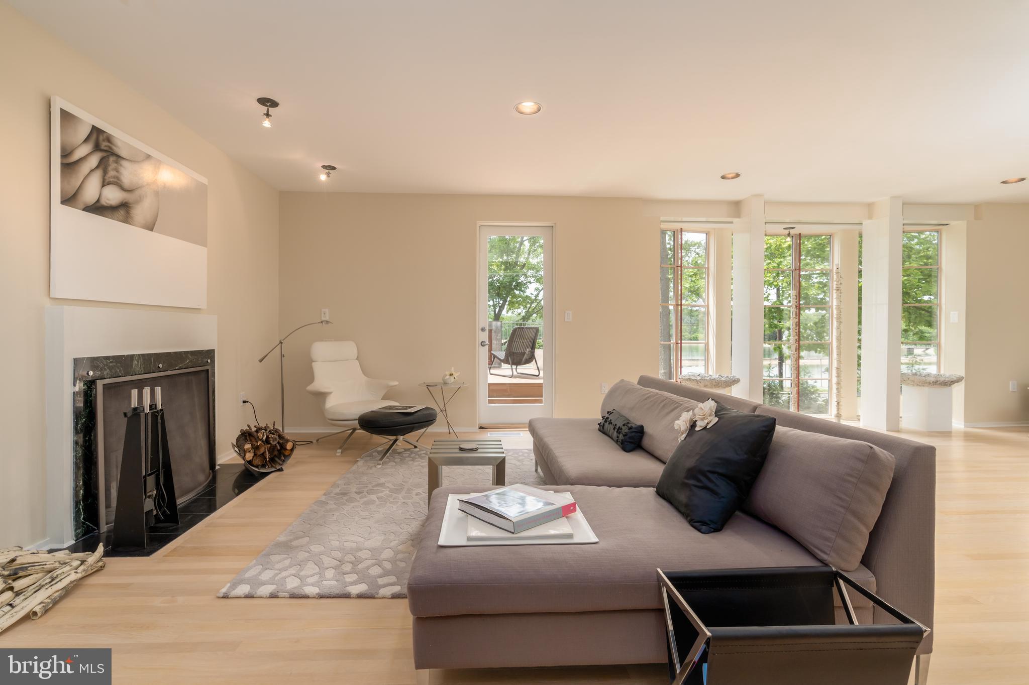 4770 Reservoir Road Northwest Washington, DC 20007 - Photo 10 of 50 Living area with wood burning FP & view to deck