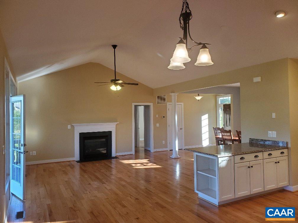 139 Wexford Ridge Road Ruckersville, VA 22968 - Photo 21 of 45 a kitchen with stainless steel appliances granite countertop a refrigerator a stove and a wooden floor