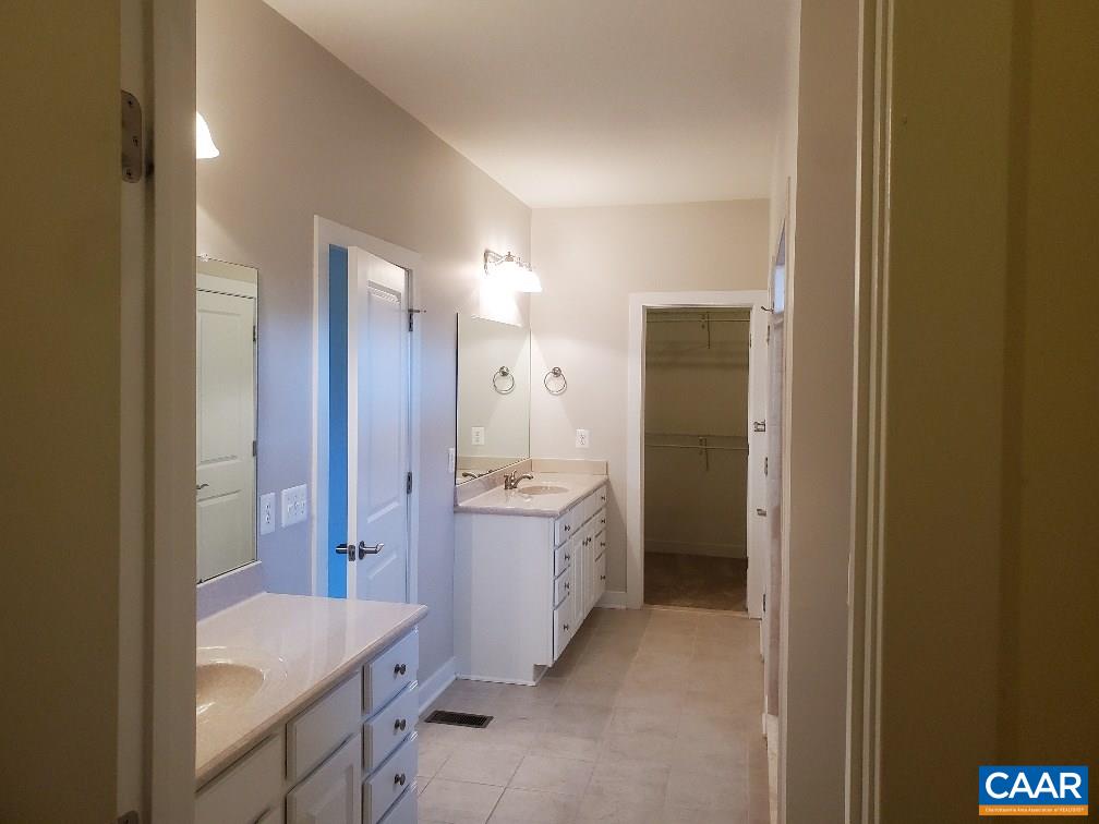139 Wexford Ridge Road Ruckersville, VA 22968 - Photo 32 of 45 a bathroom with a sink and a mirror