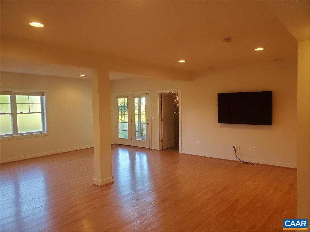 139 Wexford Ridge Road Ruckersville, VA 22968 - Photo 34 of 45 a view of a livingroom with wooden floor and windows