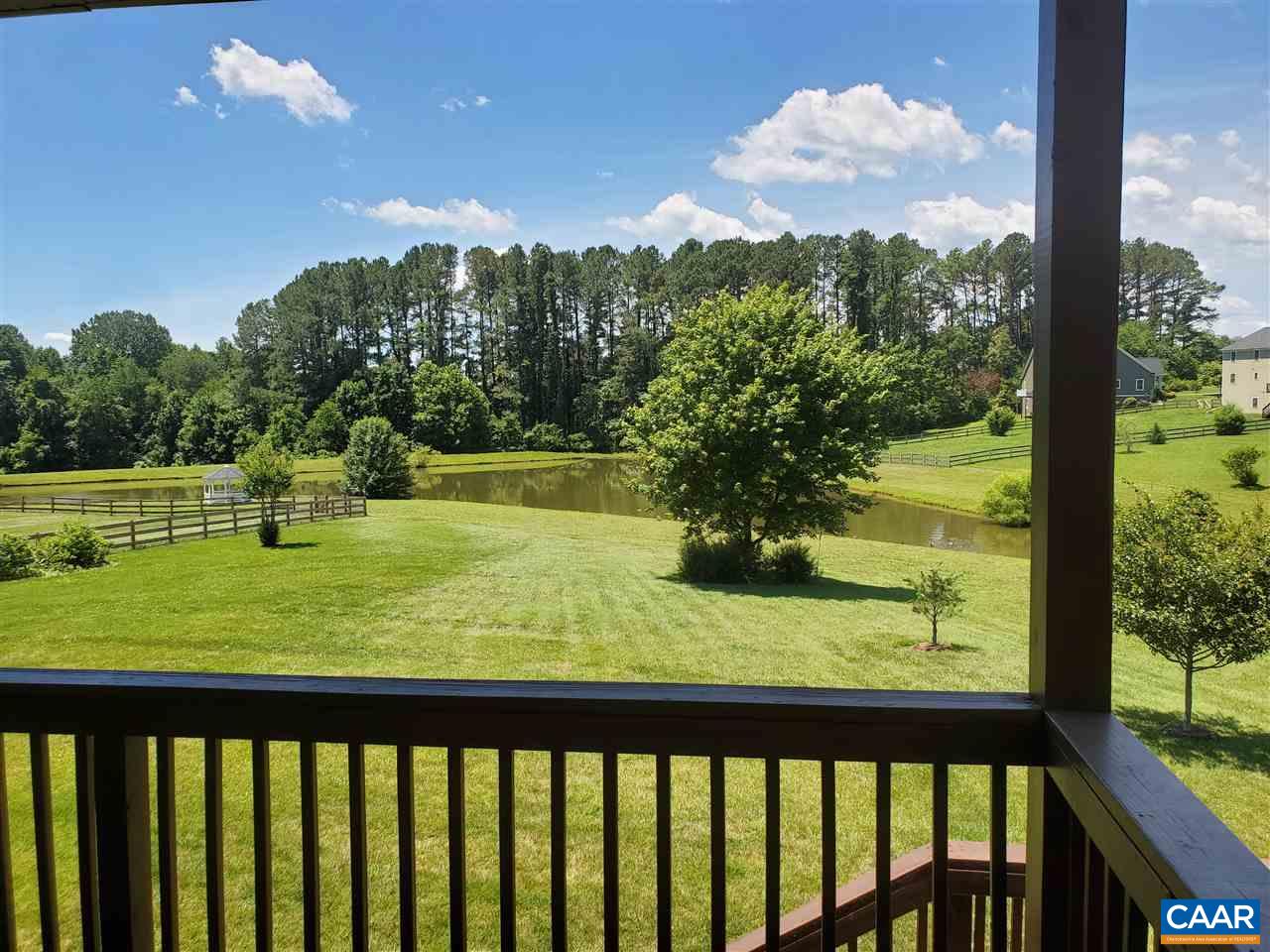 139 Wexford Ridge Road Ruckersville, VA 22968 - Photo 4 of 45 a view of a lake from a balcony