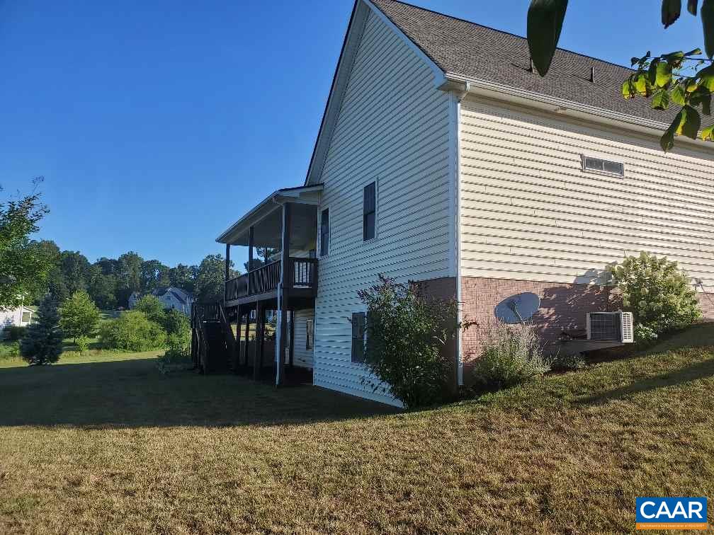 139 Wexford Ridge Road Ruckersville, VA 22968 - Photo 44 of 45 a view of a house with a yard