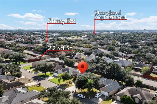 an aerial view of residential houses with outdoor space