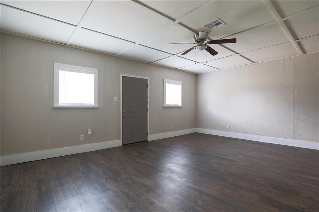 1410 Ransom Street Pflugerville, TX 78660 - Photo 10 of 22 Spare room with dark wood-type flooring and a ceiling fan
