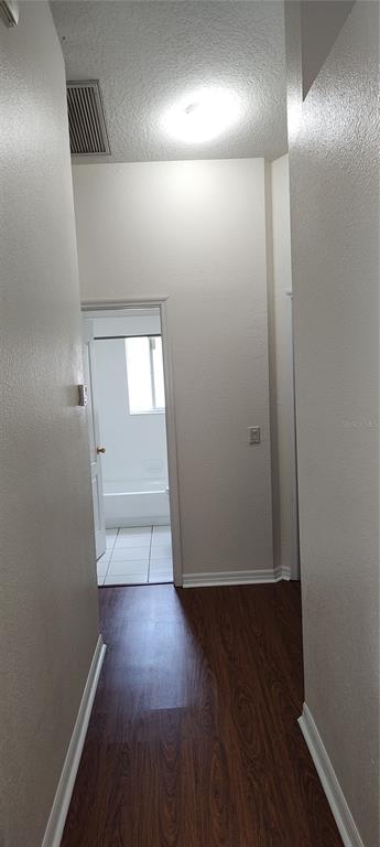 210 Chardonnay Place Valrico, FL 33594 - Photo 11 of 26 an empty room with wooden floor and windows