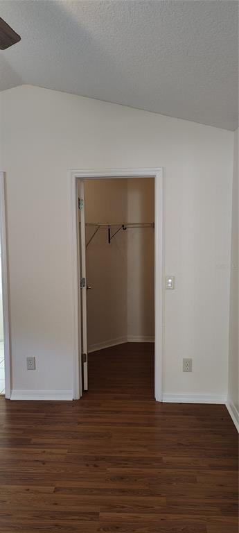210 Chardonnay Place Valrico, FL 33594 - Photo 14 of 26 a view of an empty room with wooden floor and closet