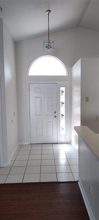 210 Chardonnay Place Valrico, FL 33594 - Photo 20 of 26 a view of an empty room with wooden floor and a window