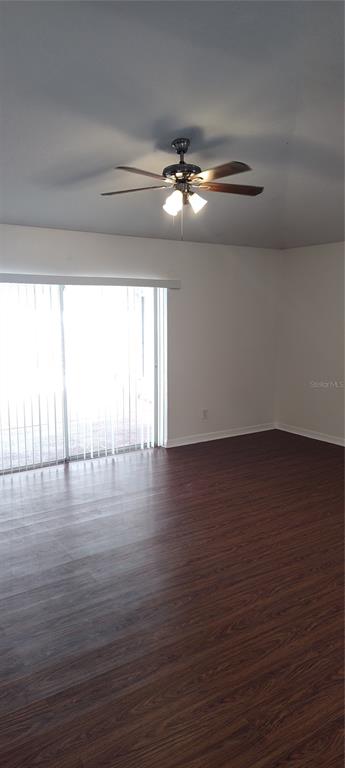 210 Chardonnay Place Valrico, FL 33594 - Photo 4 of 26 a view of empty room with wooden floor and fan