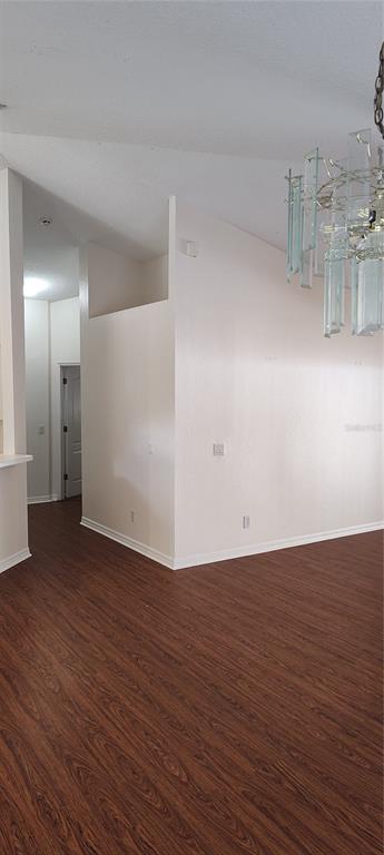 210 Chardonnay Place Valrico, FL 33594 - Photo 10 of 26 a view of an empty room with wooden floor