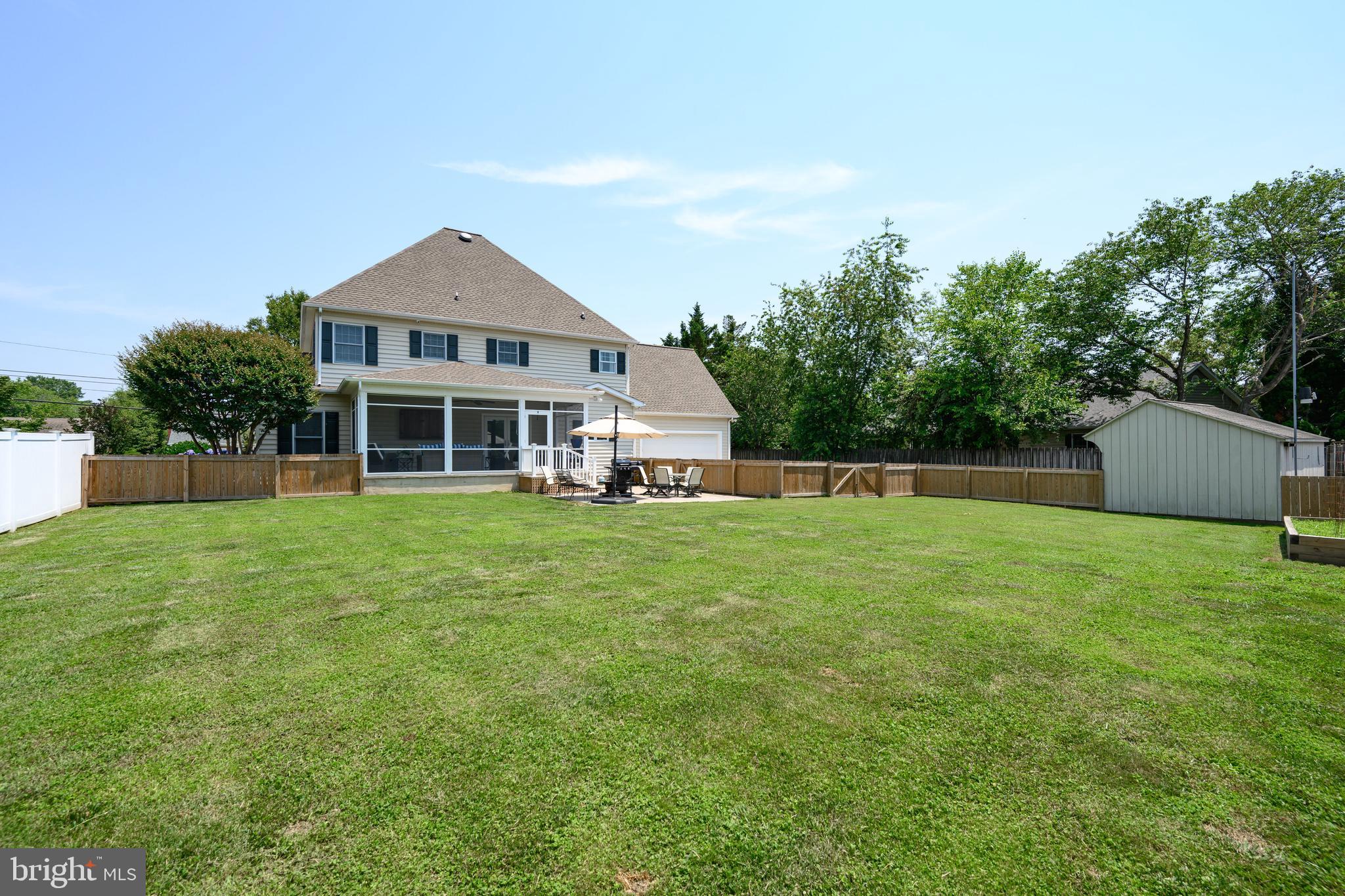 1009 South Washington Street Easton, MD 21601 - Photo 13 of 54 a front view of a house with a yard