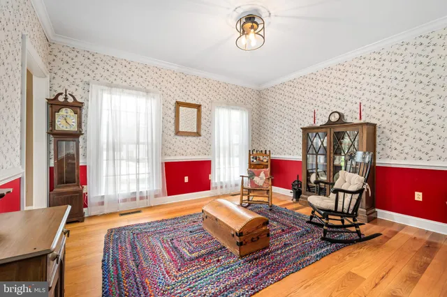 a living room with furniture gym equipment and a fireplace