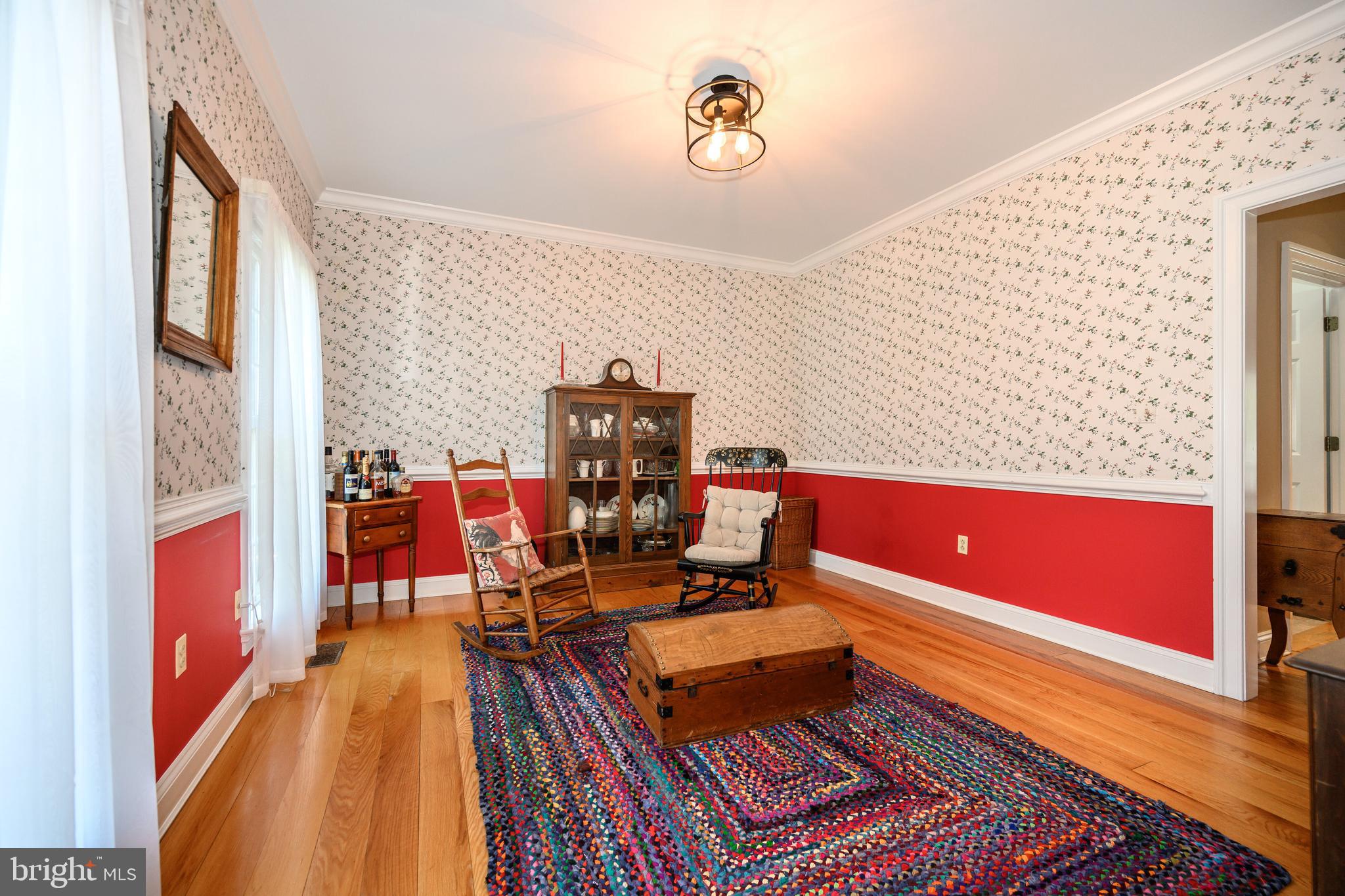 1009 South Washington Street Easton, MD 21601 - Photo 23 of 54 a living room with furniture flat screen tv and a table