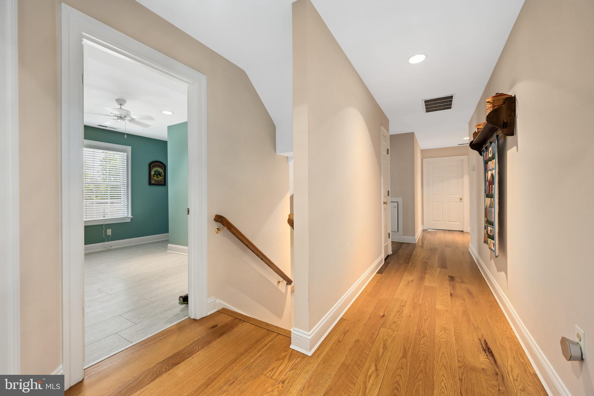 1009 South Washington Street Easton, MD 21601 - Photo 33 of 54 a view of a hallway view with wooden floor and staircase