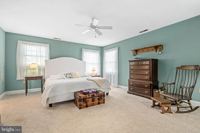 a bedroom with furniture and window