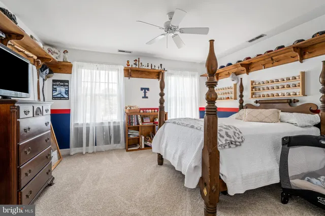 a bed room with a bed and a tv