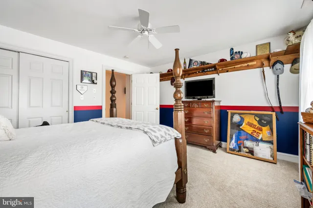 a bed room with a bed and a tv