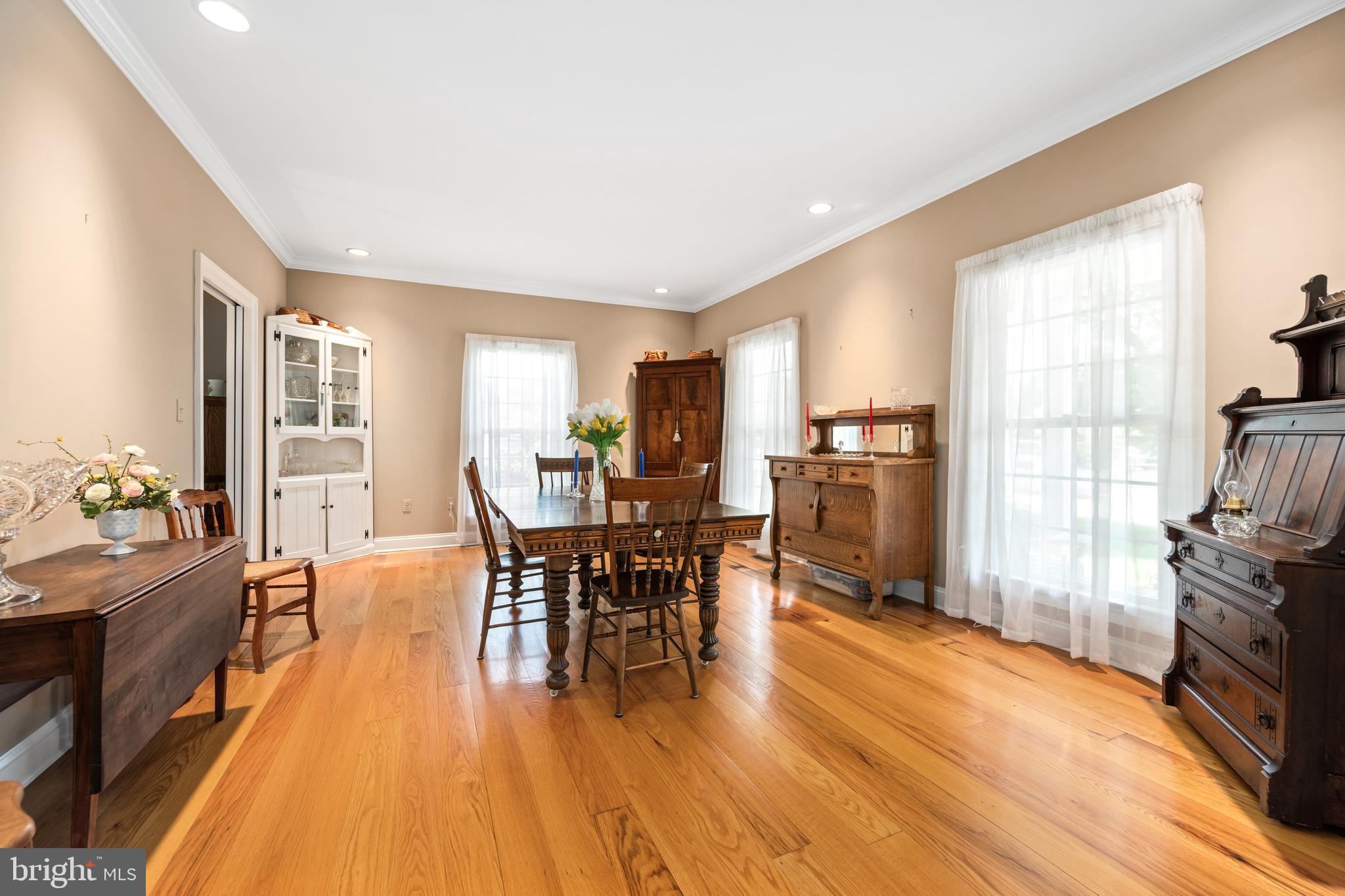1009 South Washington Street Easton, MD 21601 - Photo 5 of 54 a view of a dining room with furniture and wooden floor