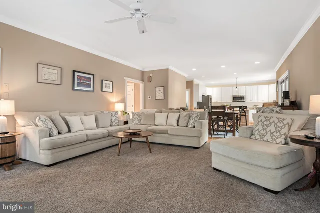 a living room with furniture white walls and white walls