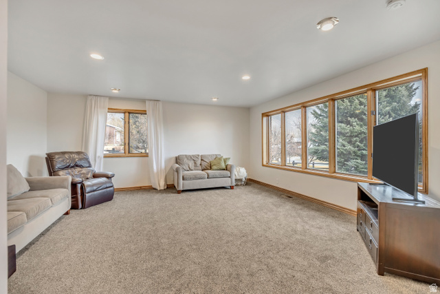 887 Village Way Alpine, UT 84004 - Photo 12 of 28 Living room with light colored carpet and recessed lighting
