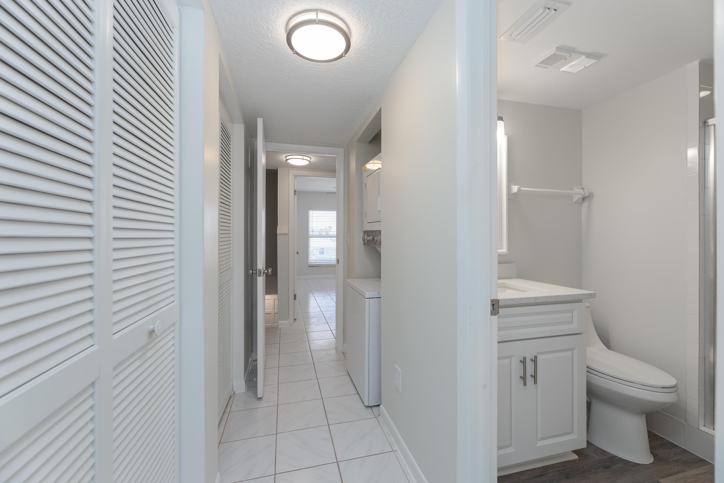 390 A1A Beach Boulevard, Unit 48 St. Augustine, FL 32080 - Photo 12 of 24 a bathroom with a toilet and a shower