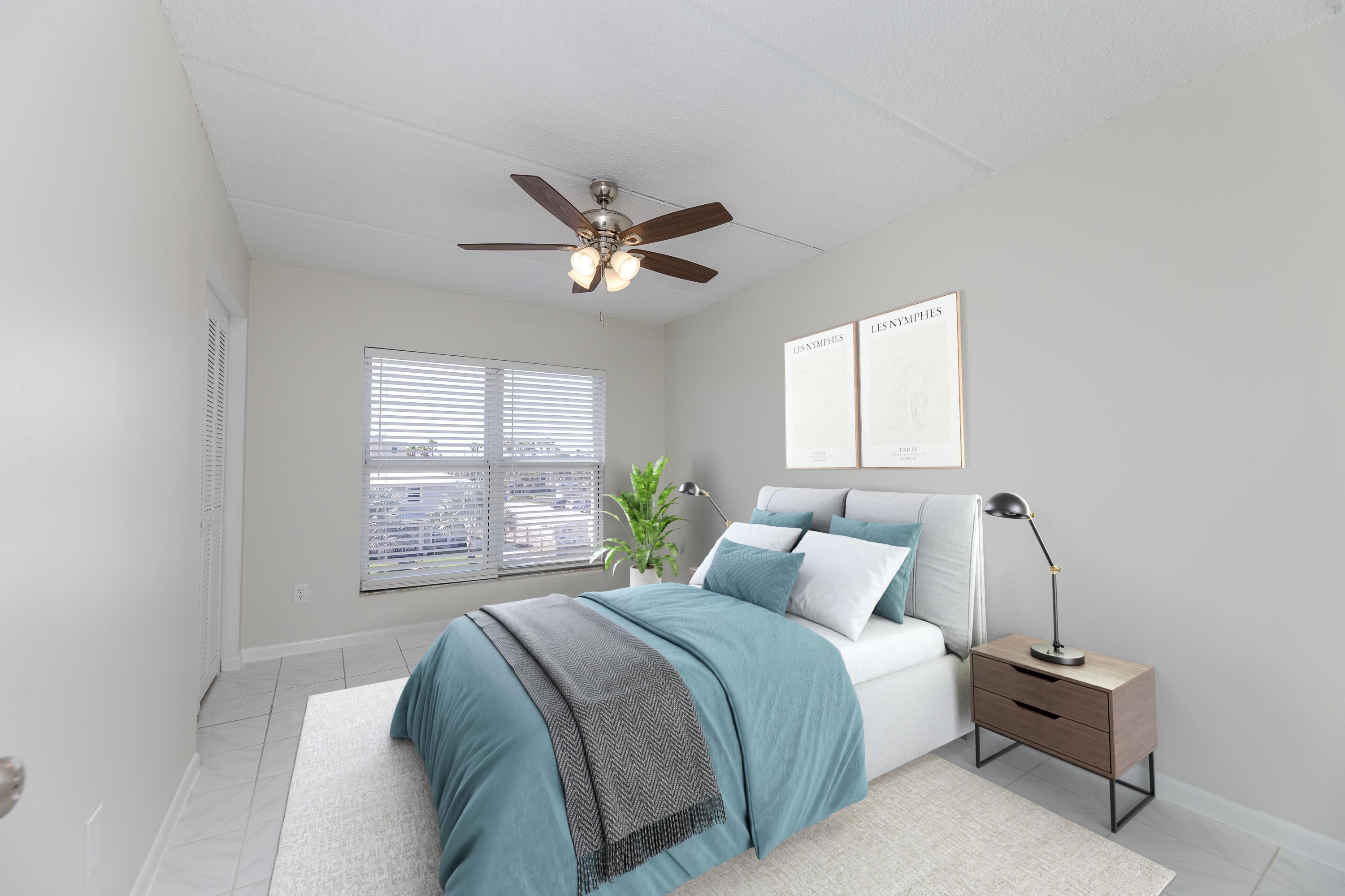 390 A1A Beach Boulevard, Unit 48 St. Augustine, FL 32080 - Photo 21 of 24 a bedroom with a large bed and a window