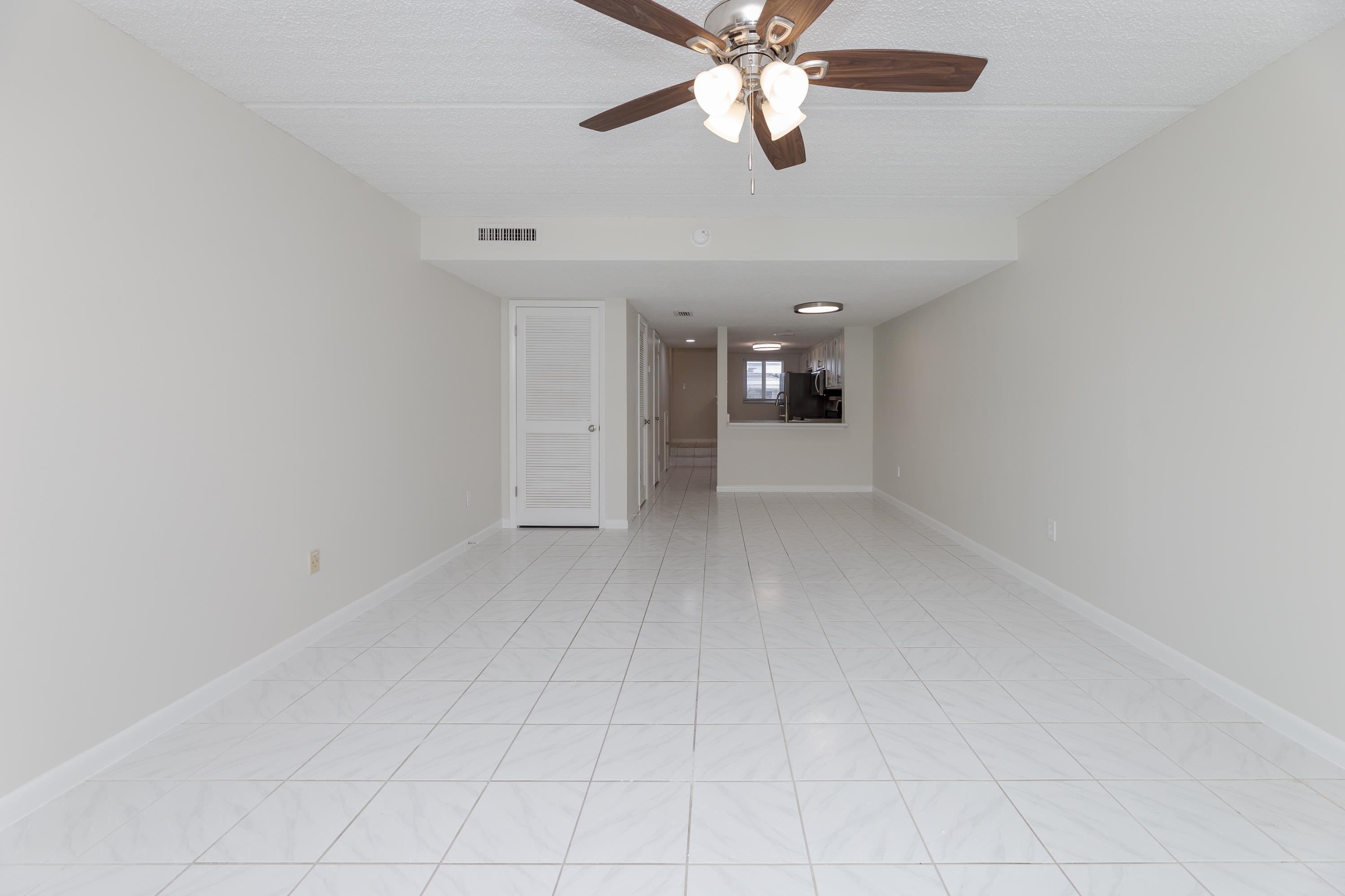 390 A1A Beach Boulevard, Unit 48 St. Augustine, FL 32080 - Photo 7 of 24 wooden floor in an empty room