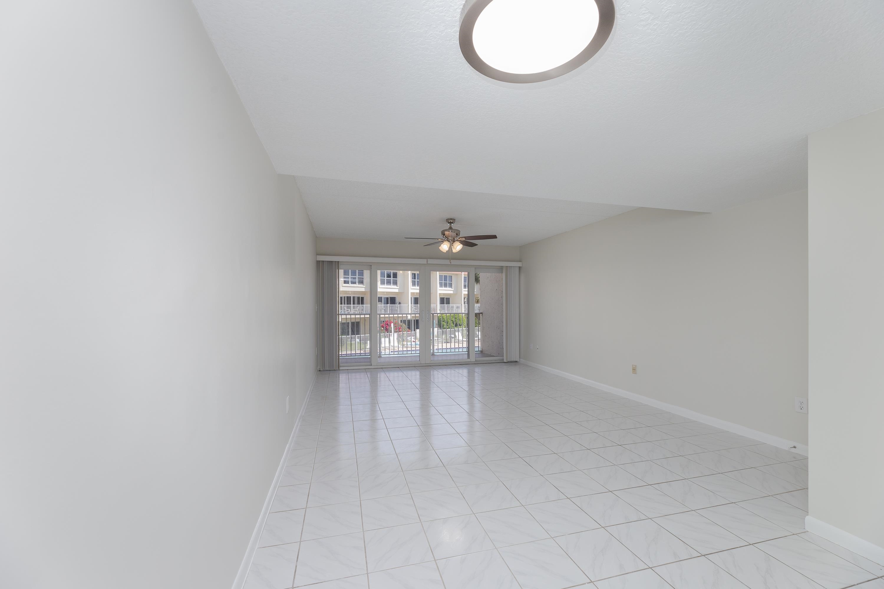 390 A1A Beach Boulevard, Unit 48 St. Augustine, FL 32080 - Photo 8 of 24 a view of an empty room with a window