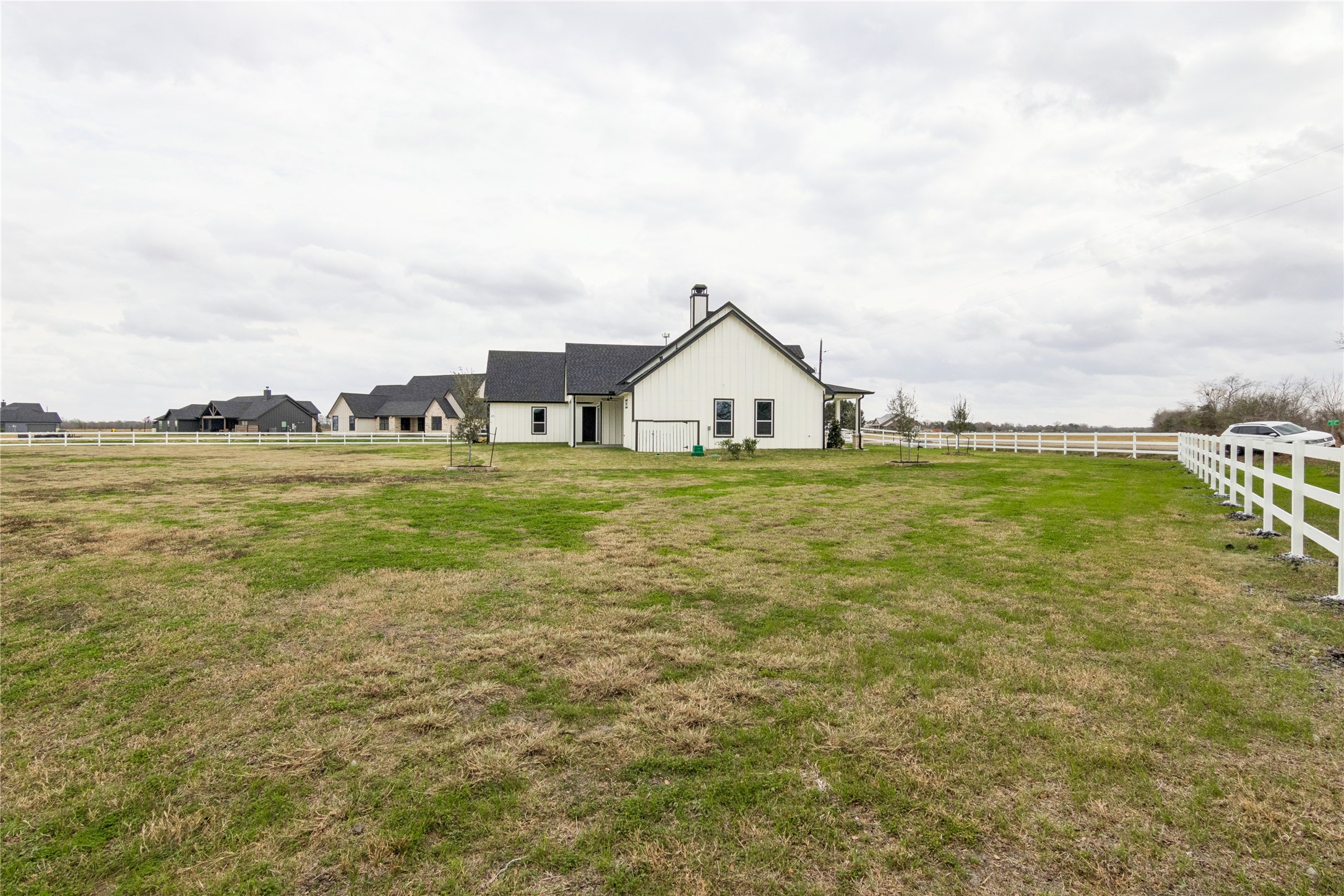 5766 Ward Bend Road Sealy, TX 77474 - Photo 45 of 45 a view of a lake with a big yard and large trees