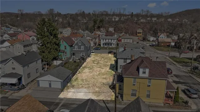 an aerial view of a residential apartment building with a yard