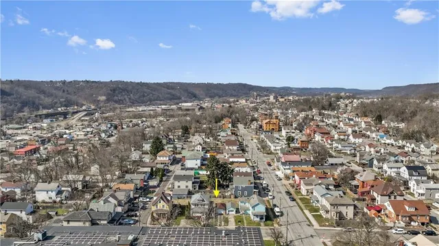 an aerial view of residential houses and city view